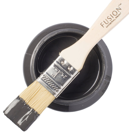 Fusion Mineral Paint brush with a sample of Ash color on a white background
