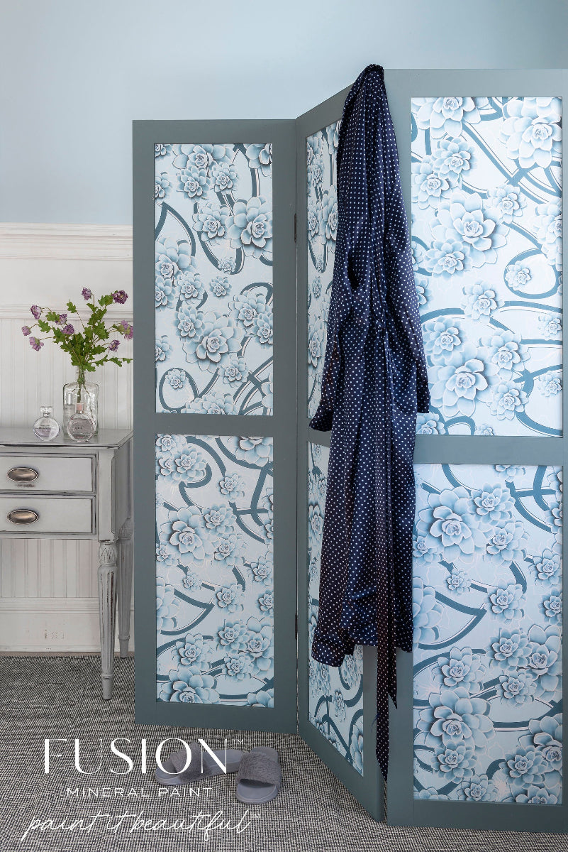 Decorative screen painted in Blue Pine colour from Fusion Mineral Paint with floral patterns and a robe branding.