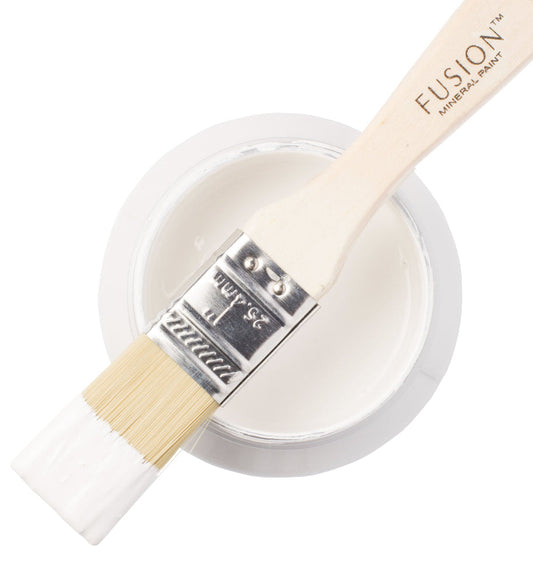 Fusion branded paintbrush with a tin of Casement coloured paint on a white background