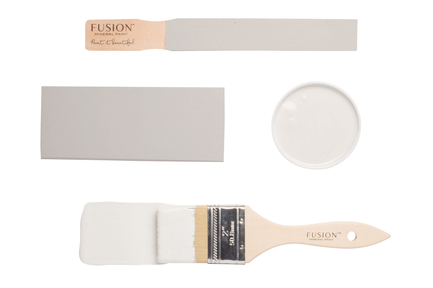 Fusion 'Cashmere' painted on colour swatches and paintbrushes on a white background