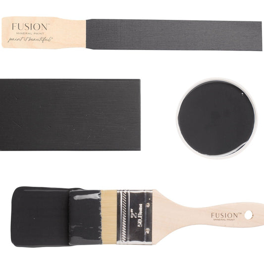 Fusion Cast Iron paint swatch with a brush and black paint on a white background