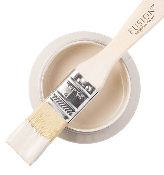 Fusion Mineral Paint in Cathedral Taupe with a paintbrush