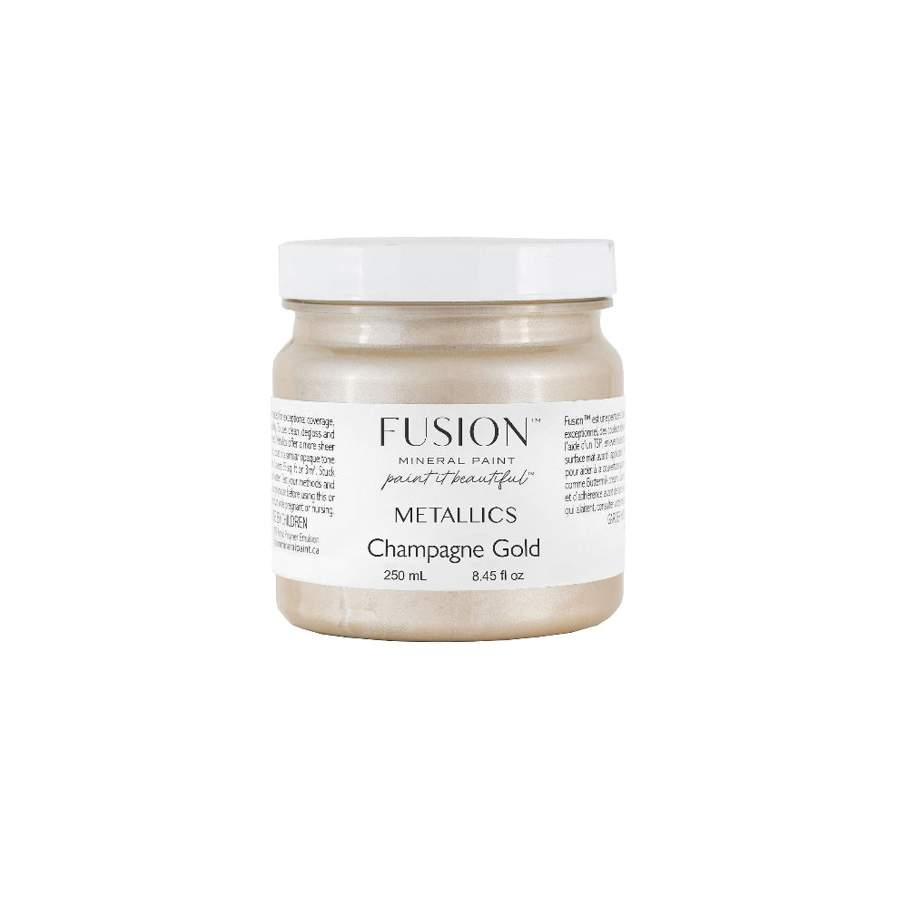 Fusion Metallics Champagne Gold paint jar on a white background