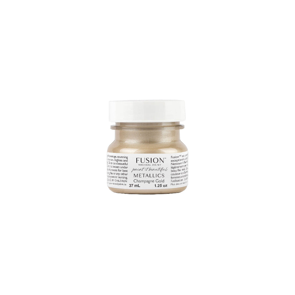 Tester size jar of Fusion Mineral Paint in Champagne Gold on a white background