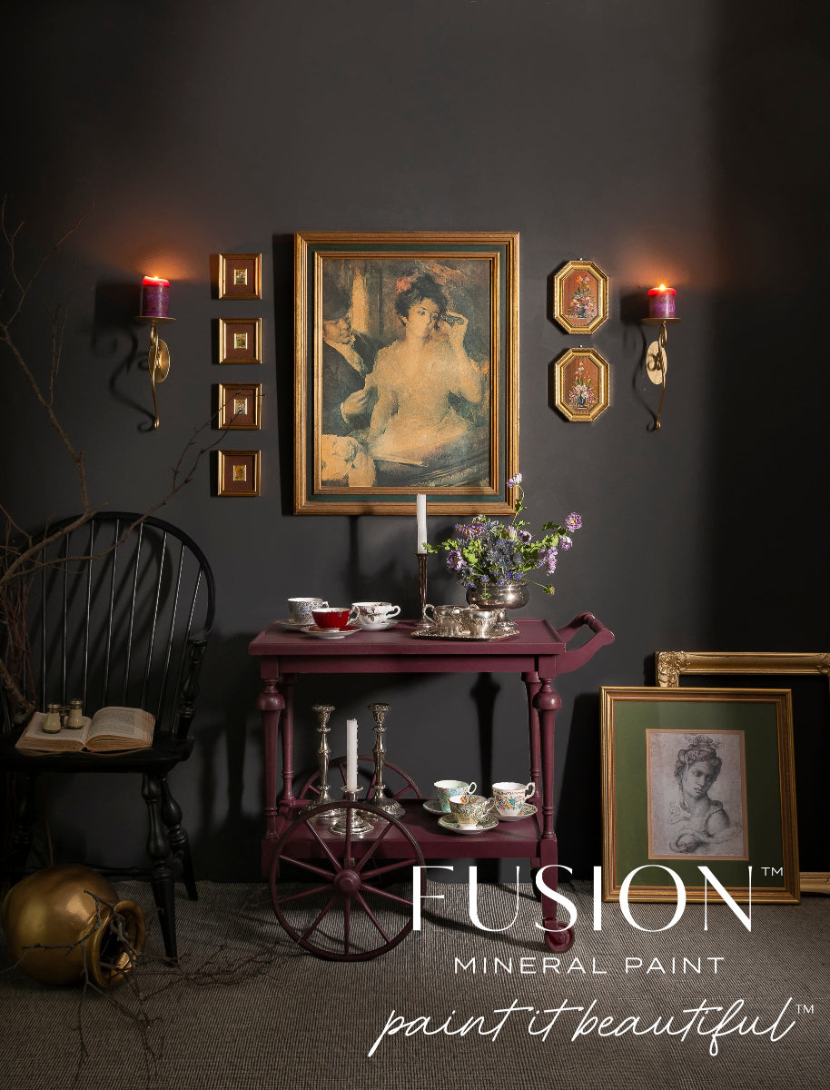 Dark interior setting a tea trolley painted in Elderberry Fusion Mineral Paint