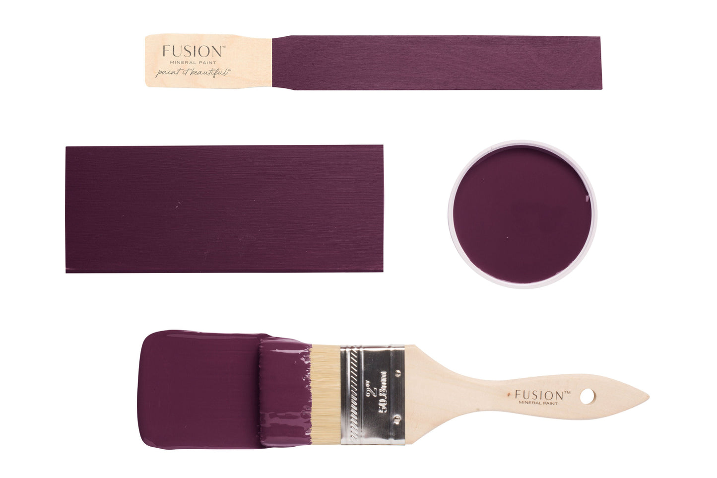 Paint swatches and brush dipped in Elderberry Fusion Mineral Paint on a white background