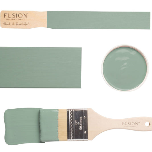 Paint brush and swatches with French Eggshell Fusion Mineral Paint on a white background