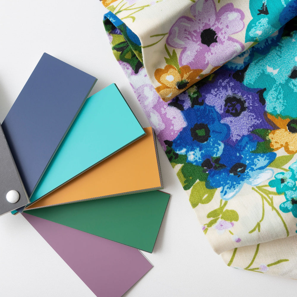 Floral fabric with Fusion Mineral Paint colour swatches on a white background