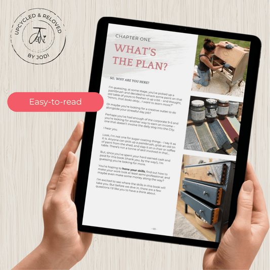 Person holding a tablet with a DIY upcycling furniture ebook called how to paint furniture that lasts, written by Upcycled & Reloved by Jodi