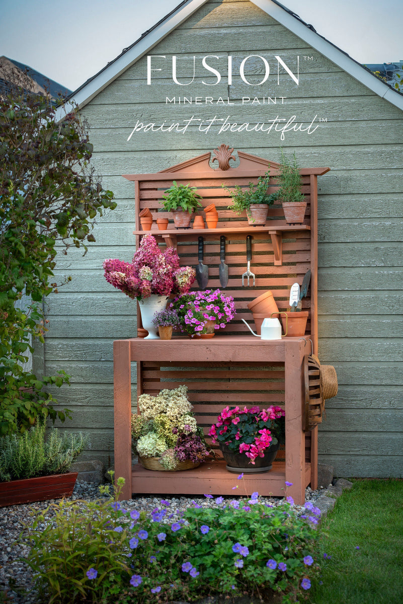 A garden trestle painted in brilliant Iron Clay from the Fusion Mineral Paint range