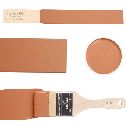 Iron Clay Fusion Mineral Paint on a brush and samples against a white background
