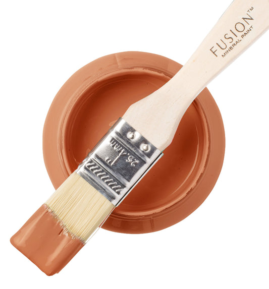Fusion Mineral Paint Iron Clay with a paintbrush on a white background