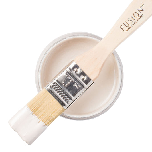 Fusion Mineral Paint in Pearl Metallic with a paintbrush on a white background