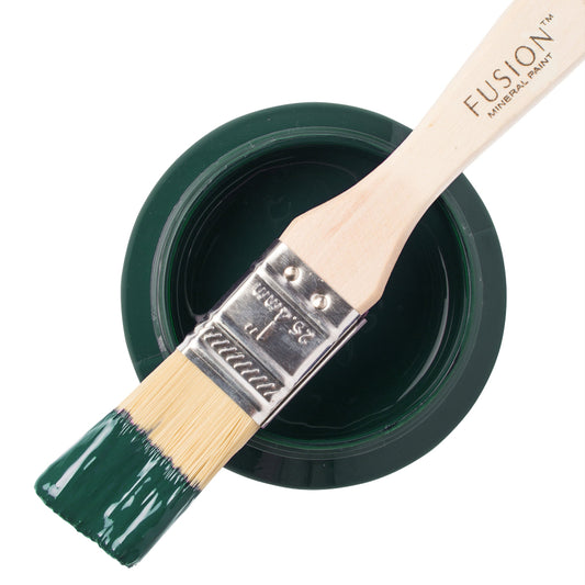 Paint brush dipped in green Pressed Fern from the Fusion Mineral Paint  range