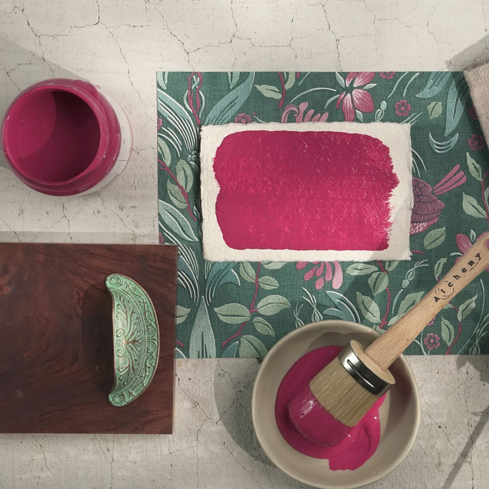 Samples and swatches of Raspberry paint from Alchemy by Fusion on various items against textured background