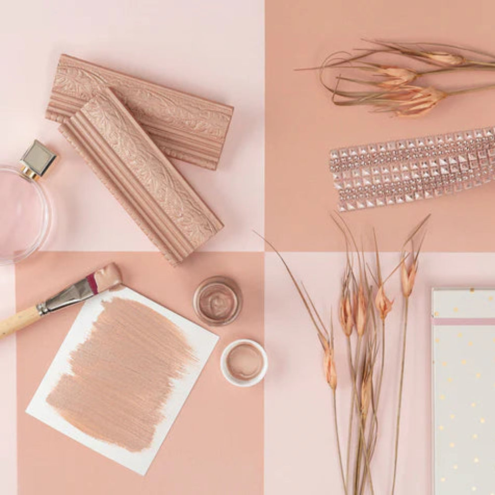 A collage of Rose Gold Metallic coloured items including lace, dry flowers and paint swatch