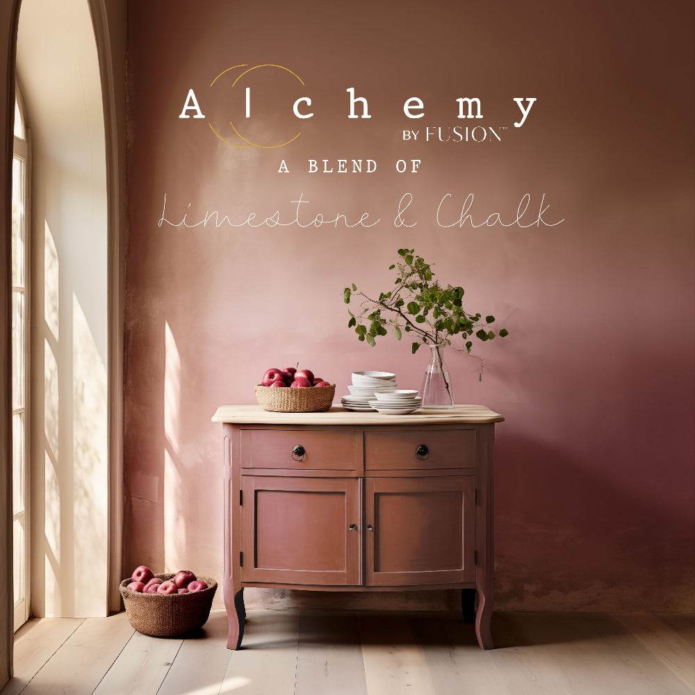 Wooden cabinet painted in rusty Sienna from Alchemy by Fusion paint range with fruit bowls and a plant against a dusty pink wall