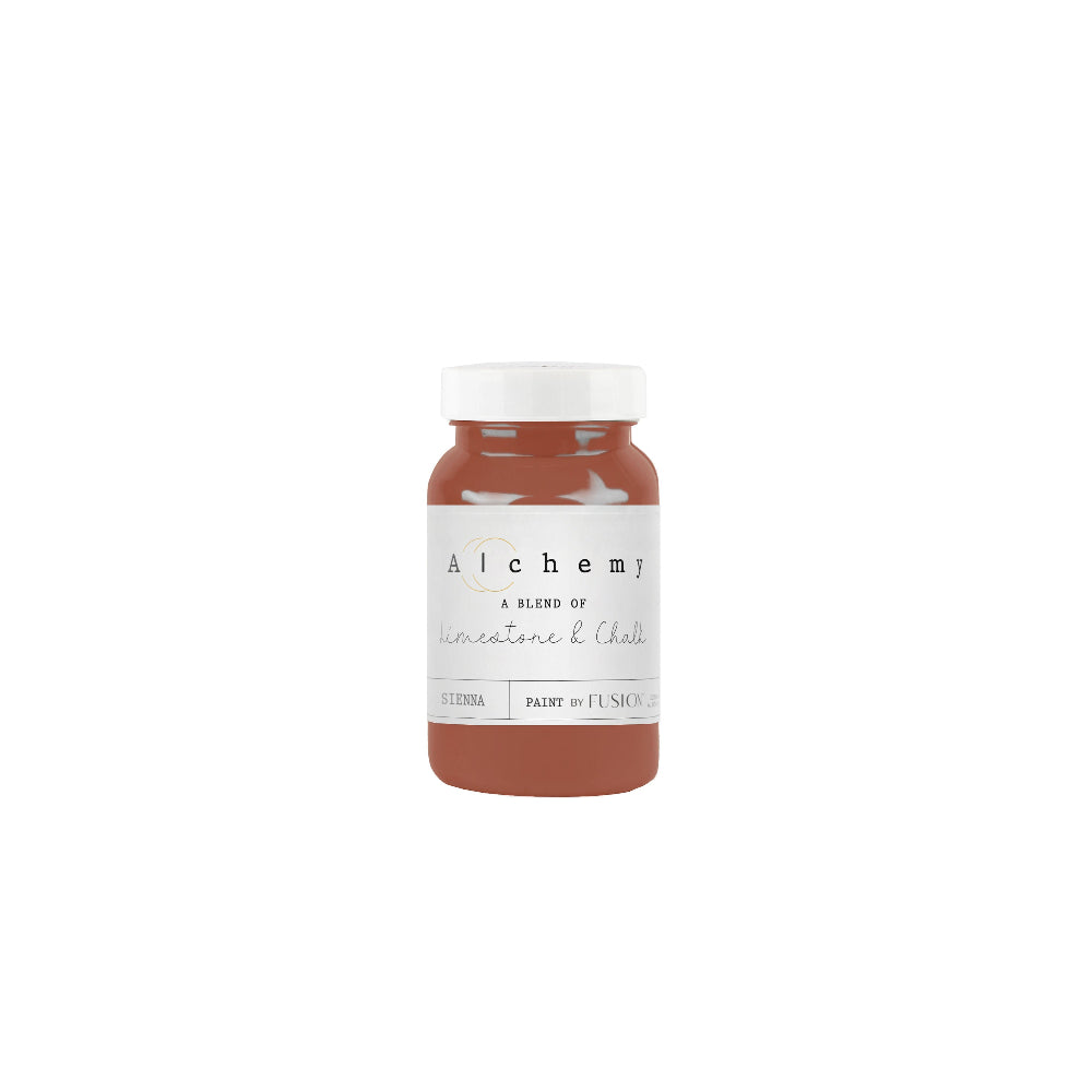 Bottle of Alchemy paint in earthy rust Sienna on a white background