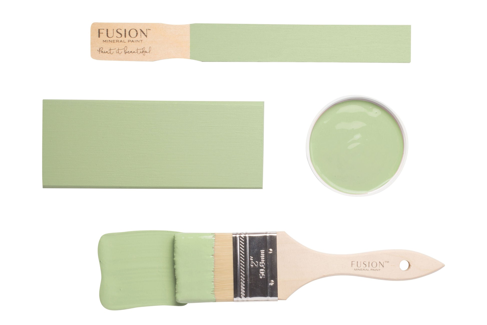 Paintbrushes with samples of Upper Canada Green paint on a white background