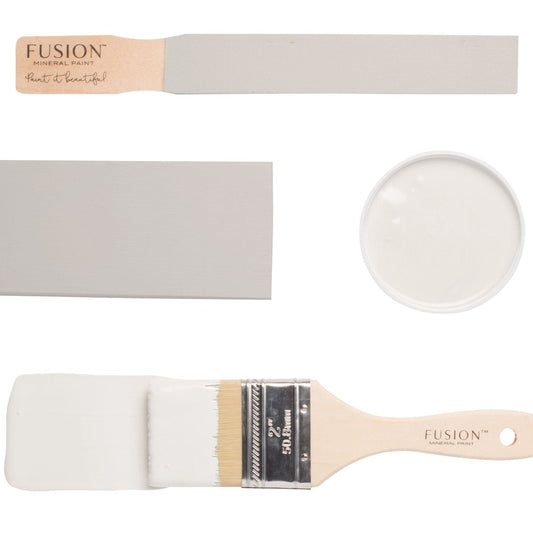 Fusion 'Cashmere' painted on colour swatches and paintbrushes on a white background