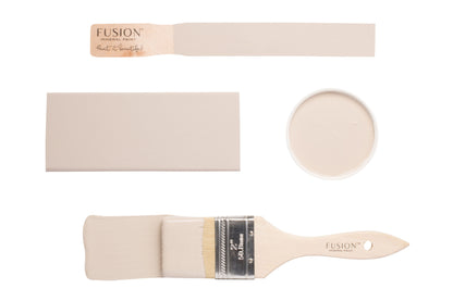 Fusion paintbrushes and colour swatch labelled 'Cathedral Taupe' on a white background