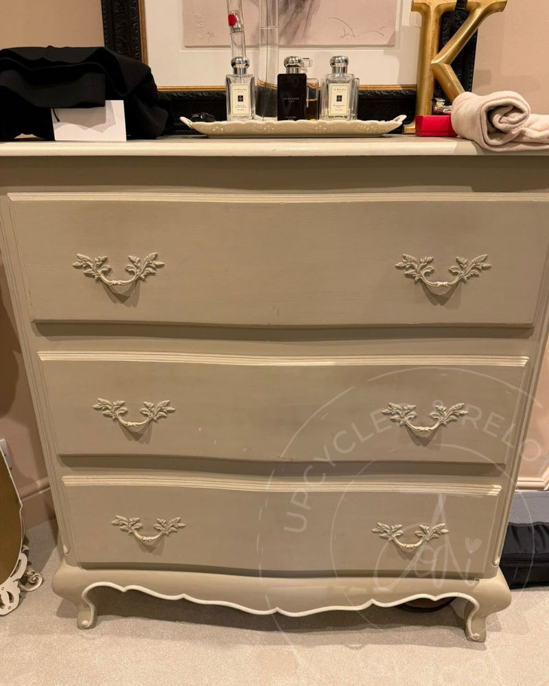 Old white painted chest of drawers with thick paint covering handles, before being refinished by Upcycled & Reloved by Jodi. 