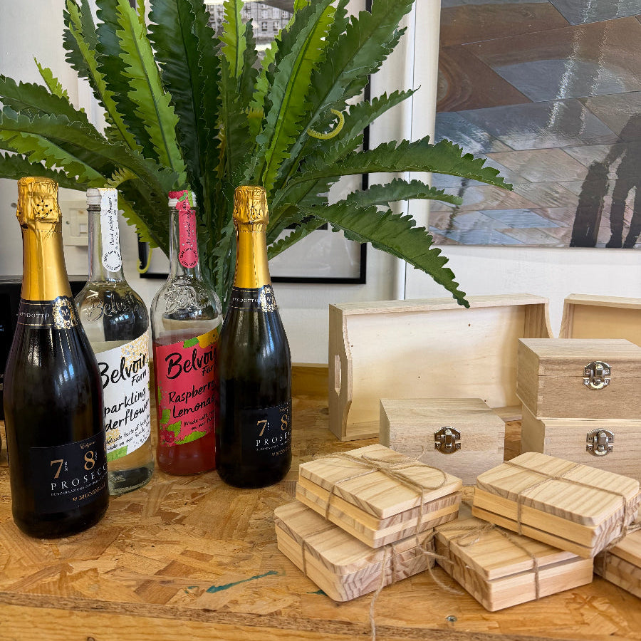 Creative Paint and Prosecco evening. A ln image of wooden craft items ready to be Painted at a creative workshop in Epsom. An intro to cycling with painting home decor during a creative workshop while sipping prosecco, relaxing and socialising