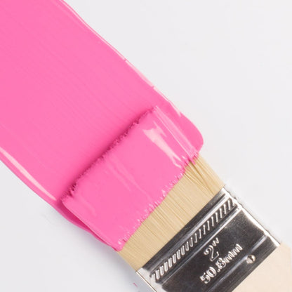 Fusion Mineral Paint in bright pink Cureiously Pink on a paintbrush