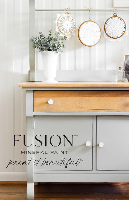 Wooden cabinet painted in the muted green of Fusion Mineral Paint in Eucalyptus
