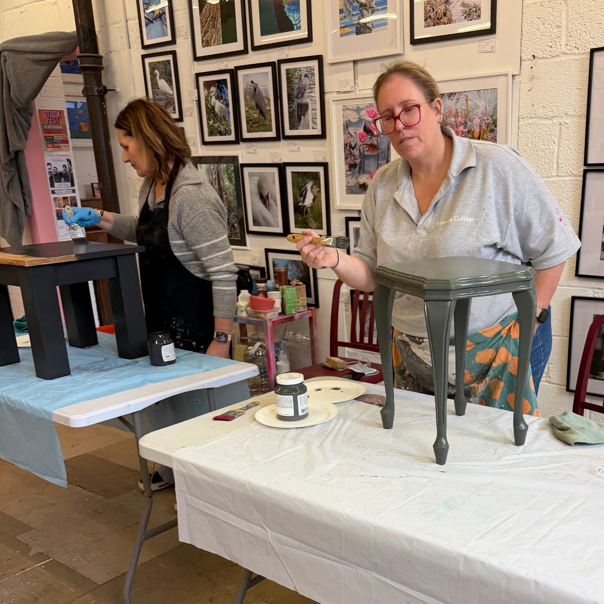 Two people working on painting furniture at an Upcycling workshop with Upcycled & Reloved by Jodi in Leatherhead Surrey