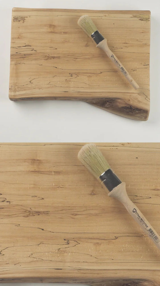 Two wooden cutting boards with basting brushes on a white background
