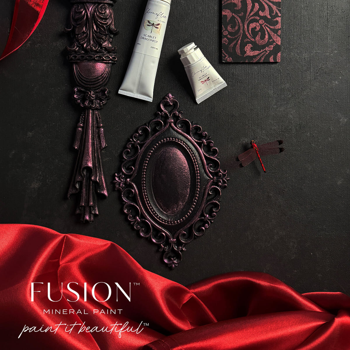 An assortment of a dragonfly and metal objects in shimmering red Scarlet Dragonfly ChromaFlex paint from Fusion Mineral Paint