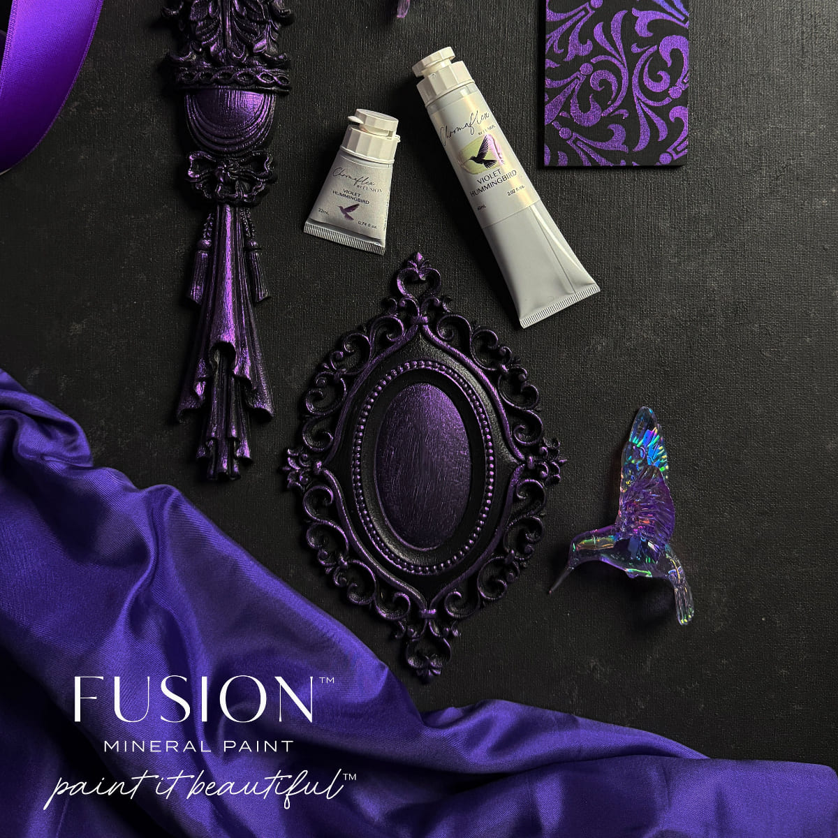 An assortment of an ornament hummingbird and metal objects in shimmering Violet Hummingbird ChromaFlex paint from Fusion Mineral Paint