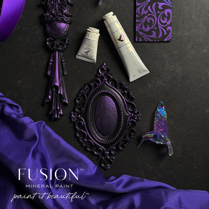 An assortment of an ornament hummingbird and metal objects in shimmering Violet Hummingbird ChromaFlex paint from Fusion Mineral Paint