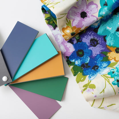 Floral fabric with Fusion Mineral Paint colour swatches on a white background