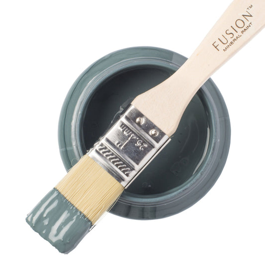 Fusion Mineral Paint in Homestead Blue with a paintbrush