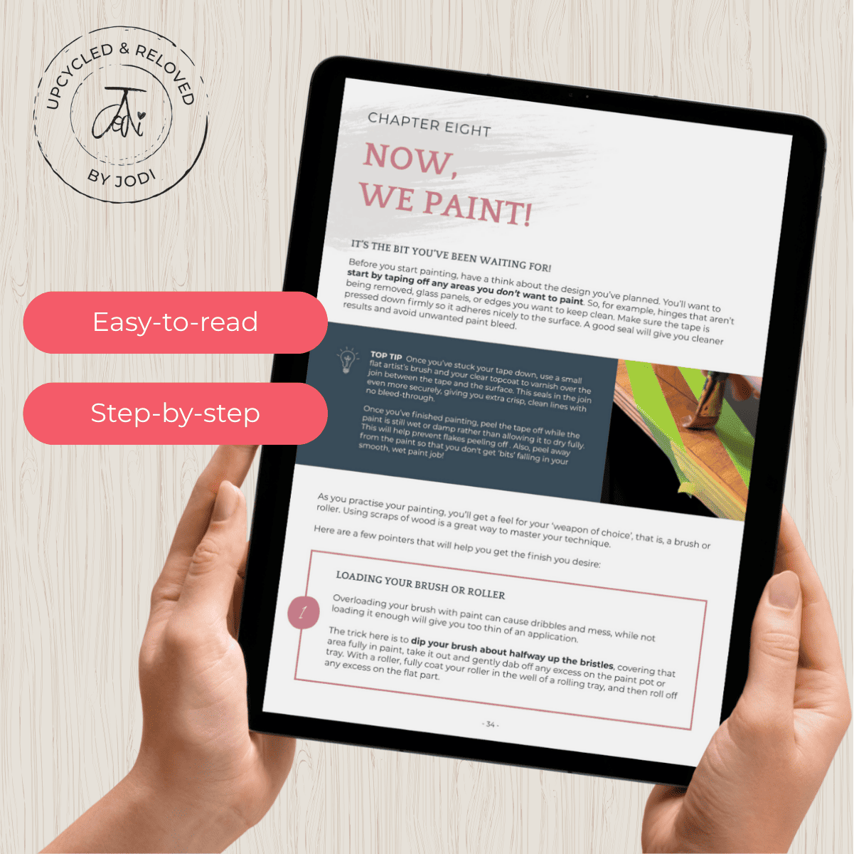 Person holding a tablet with a DIY upcycling furniture ebook called how to paint furniture that lasts, written by Upcycled & Reloved by Jodi 