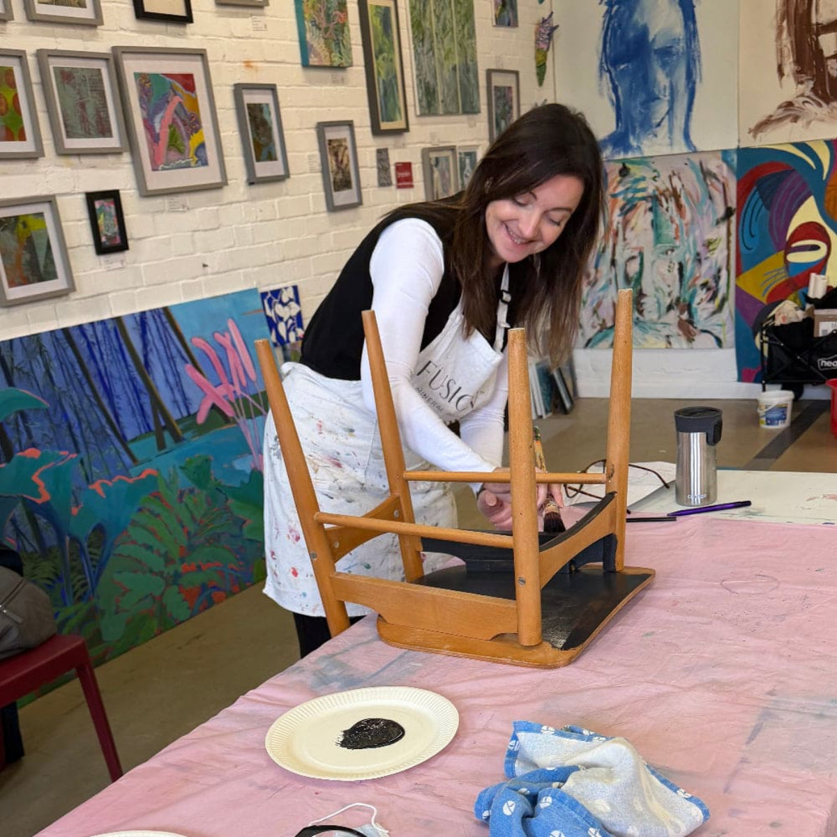 Person sanding a chair ready to paint | Upcycling class | Leatherhead