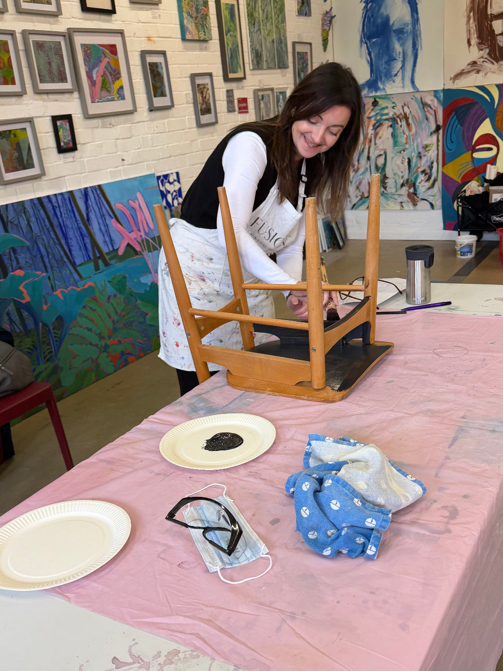 Person sanding a chair ready to paint | Upcycling class | Leatherhead