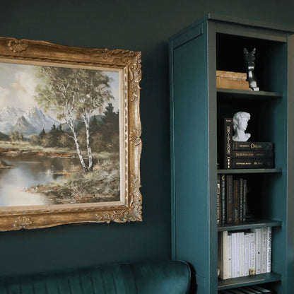 Room interior with a bookshelf painted in Manor Green from Fusion Mineral Paint range
