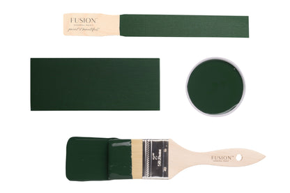 Fusion paintbrushes and paint swatches with Manor Green colour on a white background