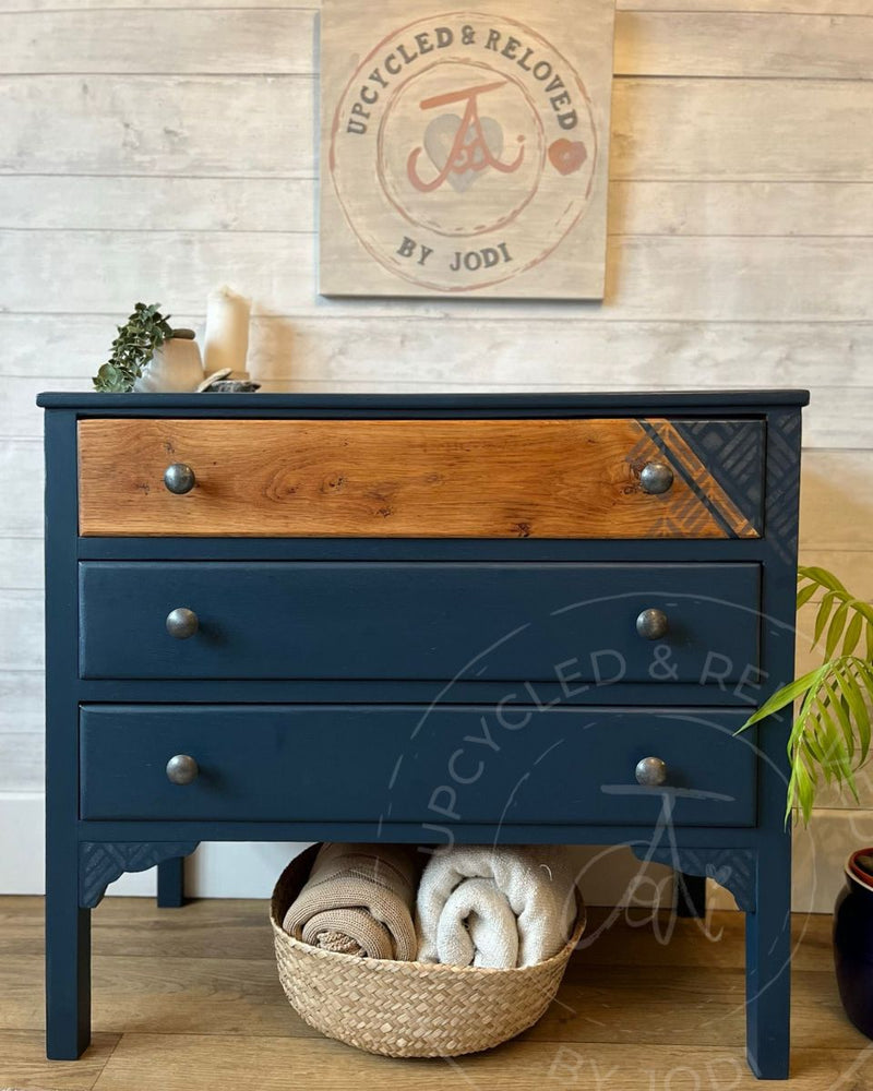 Navy and wood upcycled chest of drawers painted in Fusion Mineral Paint Willowbank with exposed wood grain and a silver wax geometric design.