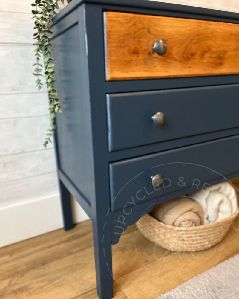 Close-up of navy painted drawers with simple pewter-style knobs from Upcycled & Reloved by Jodi. 