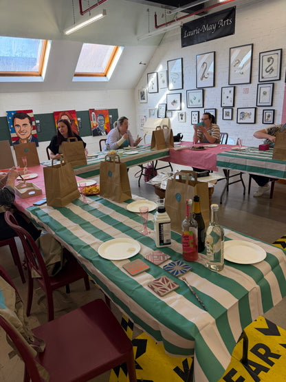 Ladies arriving for a creative paint workshop in Leatherhead at The Stockroom Society  Paint supplies and gift bags are ready for delegates to take home their painted creations.