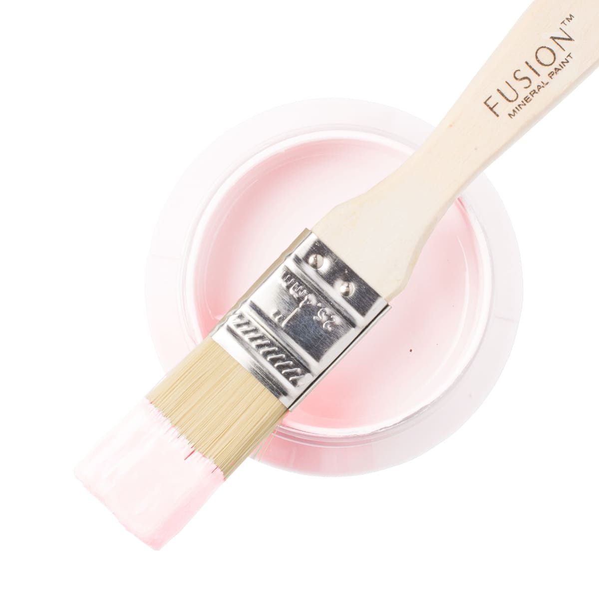 Fusion Mineral Paint stockist in Surrey Peony pink furniture paint in blush pink Fusion Mineral paint Peony on a paintbrush resting on a paint jar.