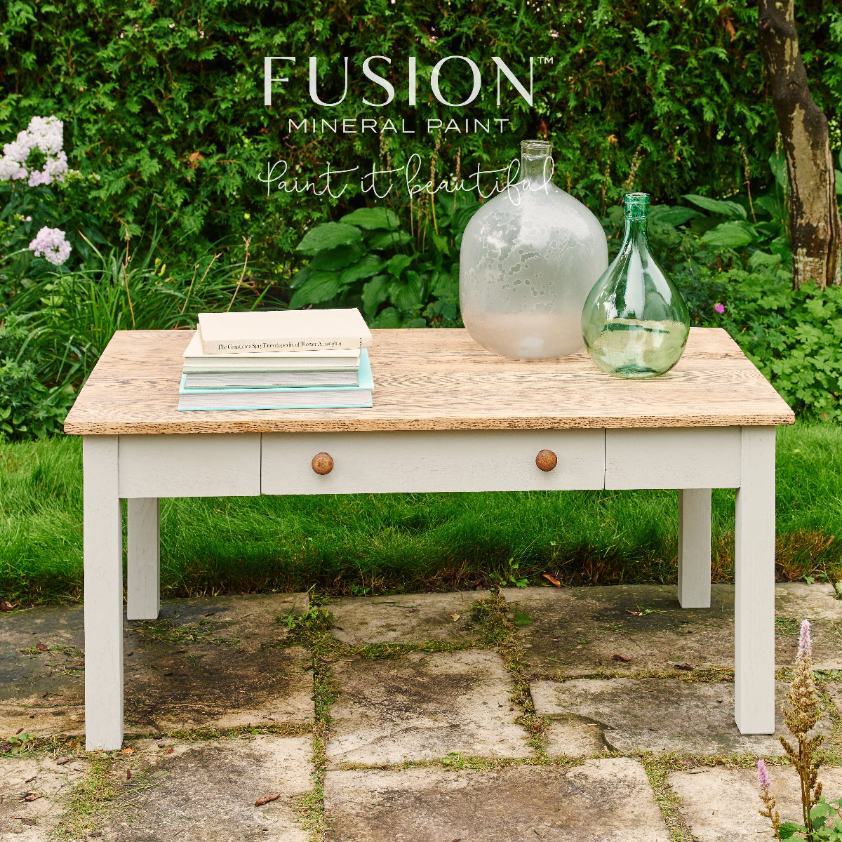 An upcycled wooden table painted in Putty Fusion Mineral Paint. The top of the table is natural wood paired with the creamy neutral Putty furniture paint on the base. 