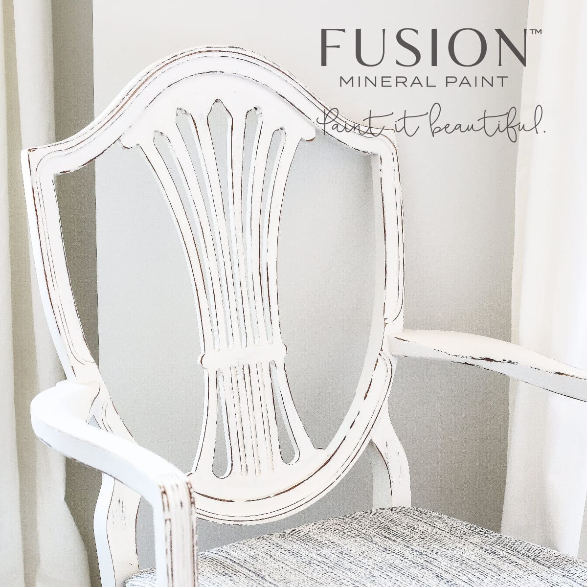 Chair with patterned cushion on a neutral background, featuring Fusion Mineral Paint branding.