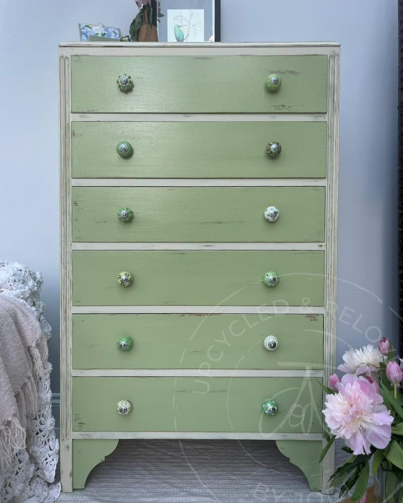A tall shabby chic style wooden chest of drawers painted in a distressed Upper Canada Green by Upcycled & Reloved by Jodi in Surrey, UK. 
