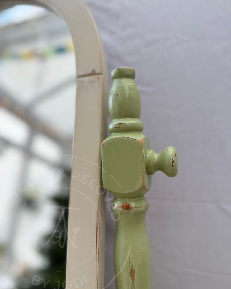 A close-up of a painted mirror support in Upper Canada Green from Fusion Mineral Paint range with softly distressed edges, restyled by Upcycled & Reloved by Jodi. 
