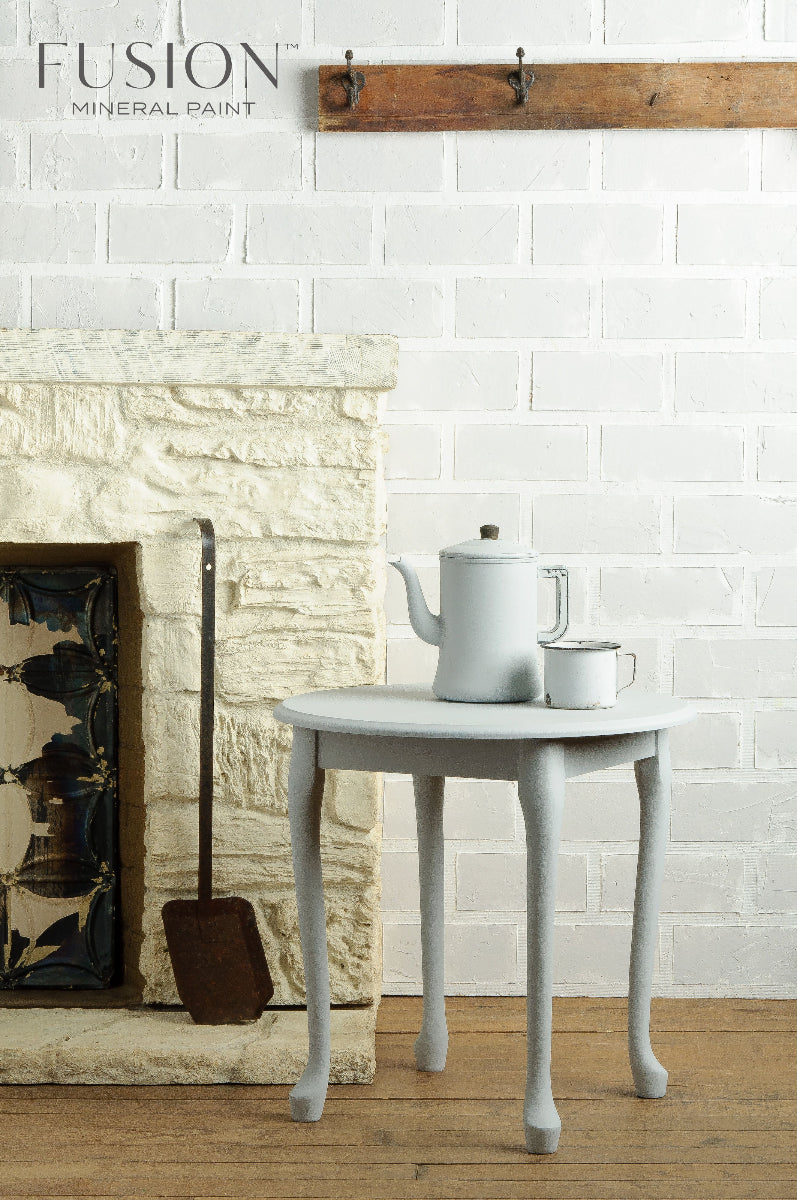 White teapot, cup and a small round table painted in Sterling from the Fusion Mineral Paint range 